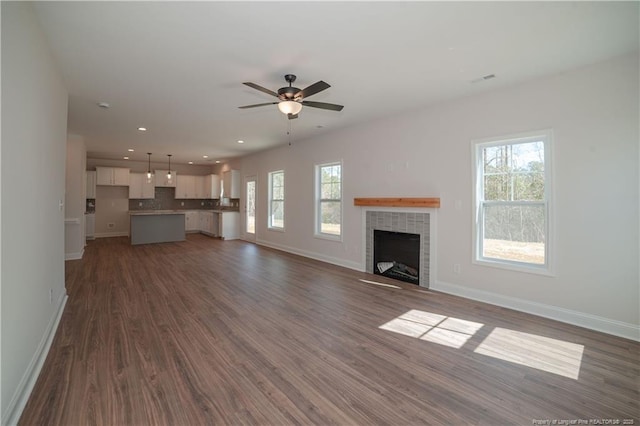 333 Edwinstowe Ave, Fayetteville, NC 28311 - unfurnished living room featuring healthy amount of natural light, baseboards, dark wood-style floors, and recessed lighting