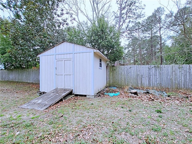 view of shed featuring a fenced backyard