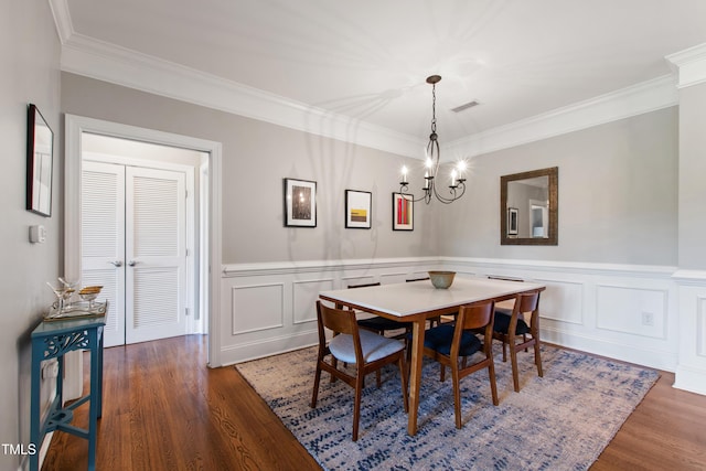 340 Allister Dr Unit 201, Raleigh, NC 27609 - dining area with crown molding, visible vents, wood finished floors, and a chandelier