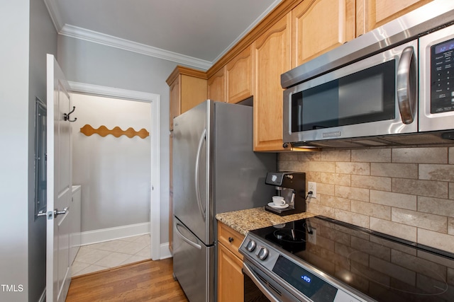 340 Allister Dr Unit 201, Raleigh, NC 27609 - kitchen featuring crown molding, appliances with stainless steel finishes, tasteful backsplash, light stone countertops, and light wood-style flooring
