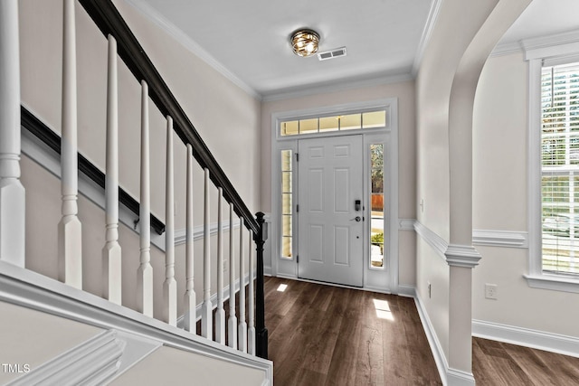 entryway with baseboards, visible vents, stairs, and dark wood-style flooring