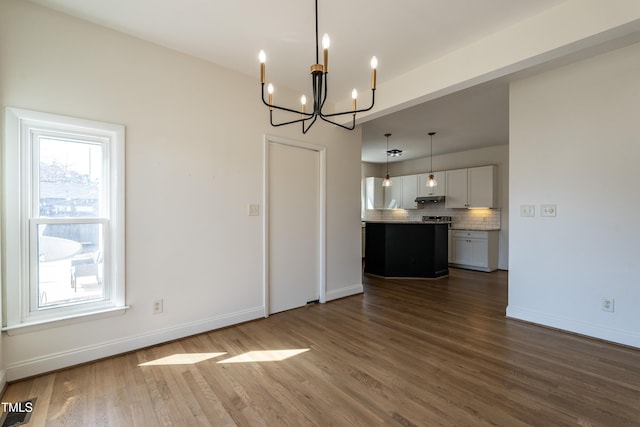 118 Riverwood Dr, Fuquay Varina, NC 27526 - unfurnished dining area featuring visible vents, baseboards, an inviting chandelier, and wood finished floors