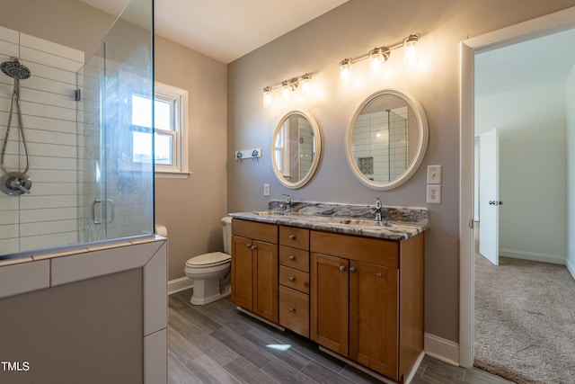 118 Riverwood Dr, Fuquay Varina, NC 27526 - bathroom featuring toilet, a sink, a tile shower, double vanity, and baseboards