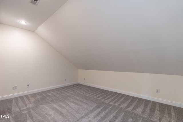 118 Riverwood Dr, Fuquay Varina, NC 27526 - additional living space with lofted ceiling, carpet flooring, baseboards, and visible vents