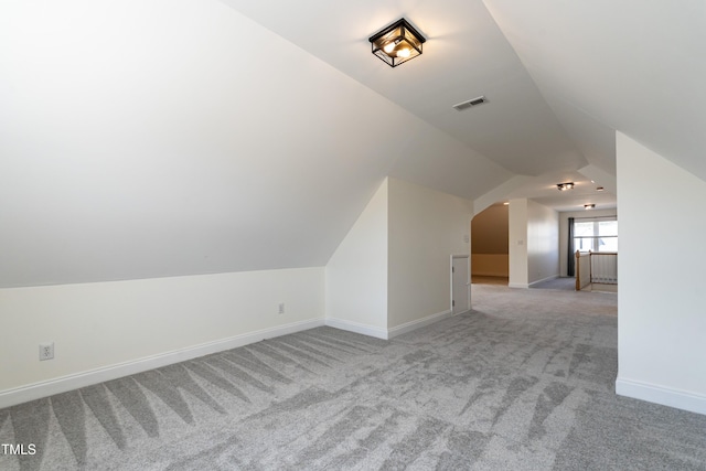 118 Riverwood Dr, Fuquay Varina, NC 27526 - bonus room featuring light carpet, visible vents, baseboards, and lofted ceiling