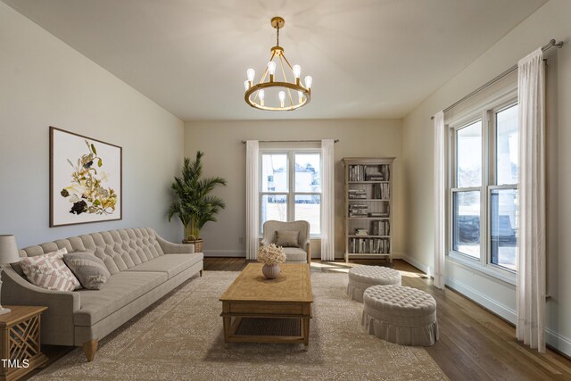 118 Riverwood Dr, Fuquay Varina, NC 27526 - living area featuring wood finished floors, baseboards, and a chandelier