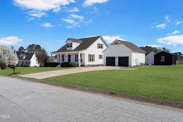 118 Riverwood Dr, Fuquay Varina, NC 27526 - new england style home with concrete driveway, a front yard, covered porch, an outbuilding, and an attached garage