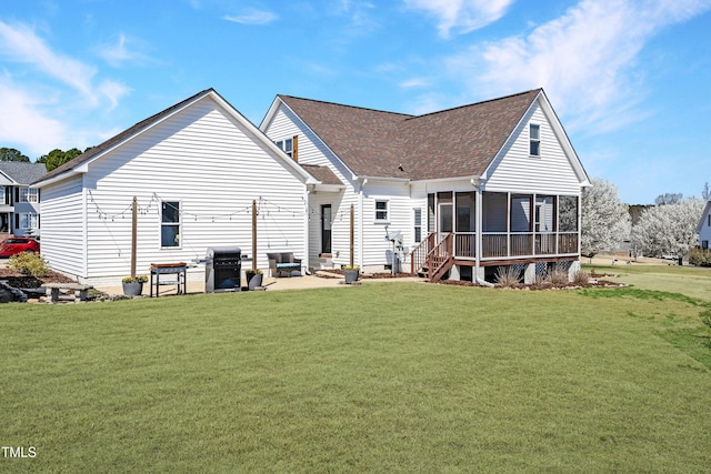 118 Riverwood Dr, Fuquay Varina, NC 27526 - rear view of house with a yard, a sunroom, and a shingled roof