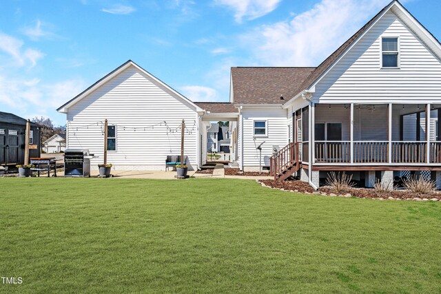 118 Riverwood Dr, Fuquay Varina, NC 27526 - rear view of property featuring crawl space, roof with shingles, a lawn, a sunroom, and a patio area