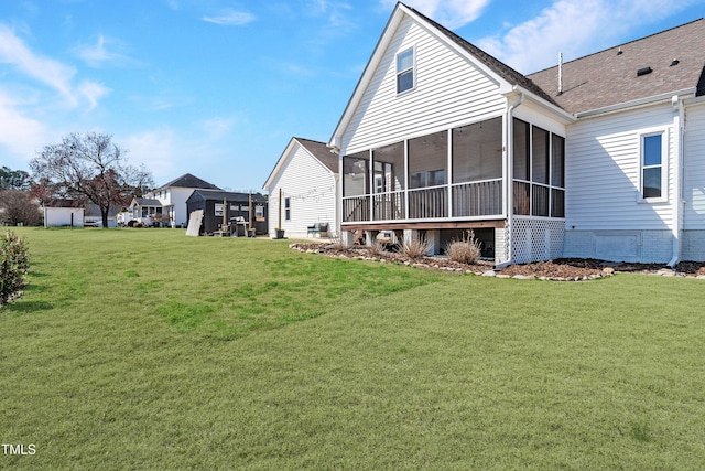 118 Riverwood Dr, Fuquay Varina, NC 27526 - rear view of property with a shingled roof, a yard, and a sunroom