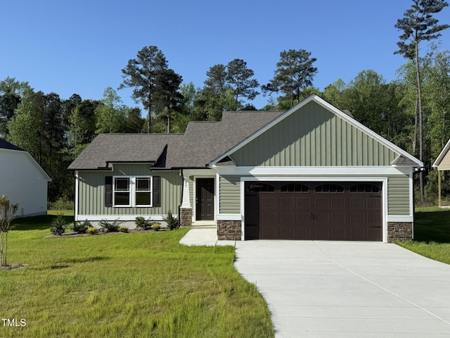 86 Heatherglenn Cir, Princeton, NC 27569 - craftsman-style home with board and batten siding, a front yard, stone siding, an attached garage, and driveway