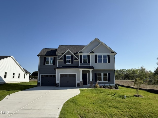 87 Heatherglenn Cir, Princeton, NC 27569 - craftsman inspired home featuring an attached garage, concrete driveway, stone siding, and a front lawn