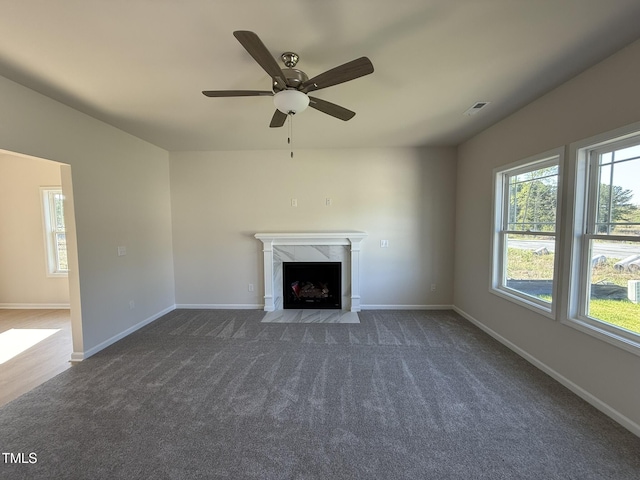 87 Heatherglenn Cir, Princeton, NC 27569 - unfurnished living room with ceiling fan, carpet, visible vents, a premium fireplace, and baseboards