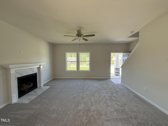 87 Heatherglenn Cir, Princeton, NC 27569 - unfurnished living room with ceiling fan, carpet flooring, baseboards, and a fireplace
