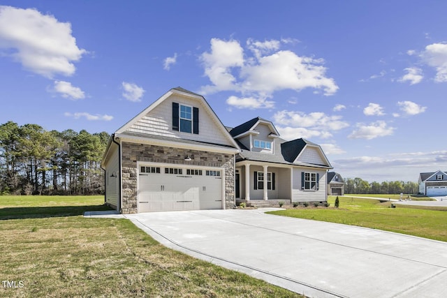 view of front facade featuring stone siding, driveway, a garage, and a front lawn
