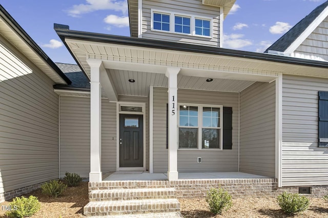 entrance to property featuring a porch