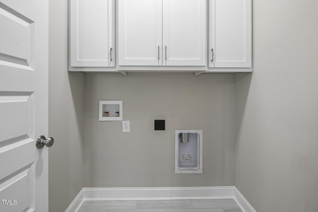 laundry area with baseboards, cabinet space, hookup for a washing machine, and electric dryer hookup