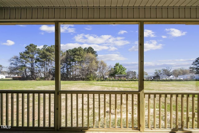 wooden terrace with a yard
