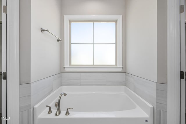 full bath featuring a bath