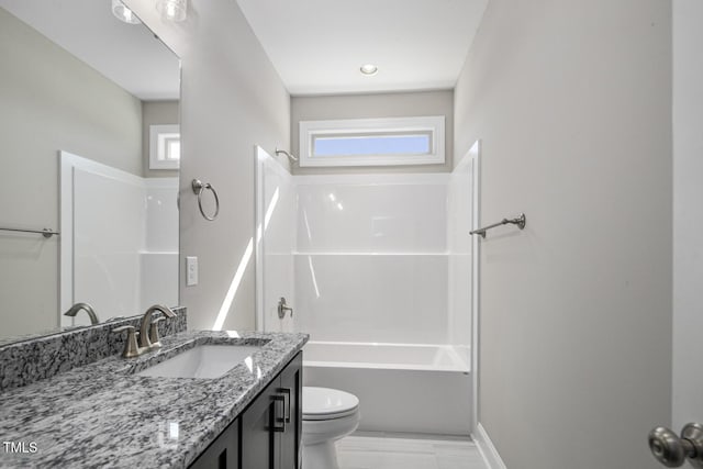 bathroom featuring  shower combination, toilet, and vanity