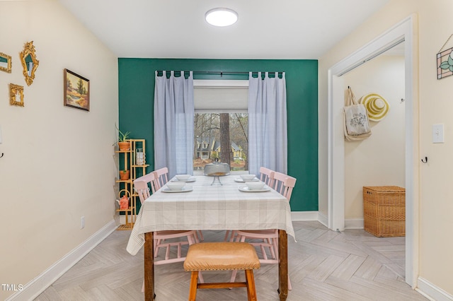 dining room with baseboards