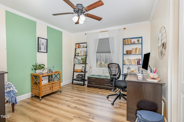 office space featuring baseboards, ornamental molding, a ceiling fan, and light wood finished floors