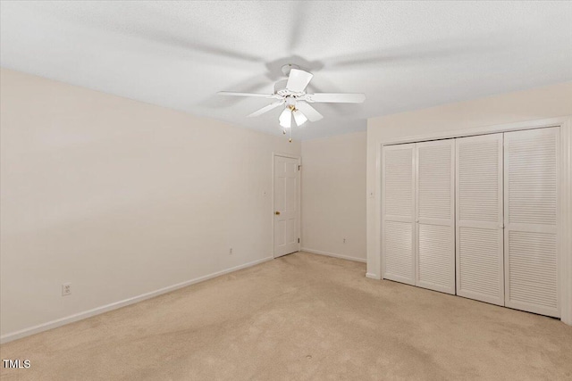 901 Emory Ln, Raleigh, NC 27609 - unfurnished bedroom featuring light colored carpet, baseboards, a closet, and ceiling fan
