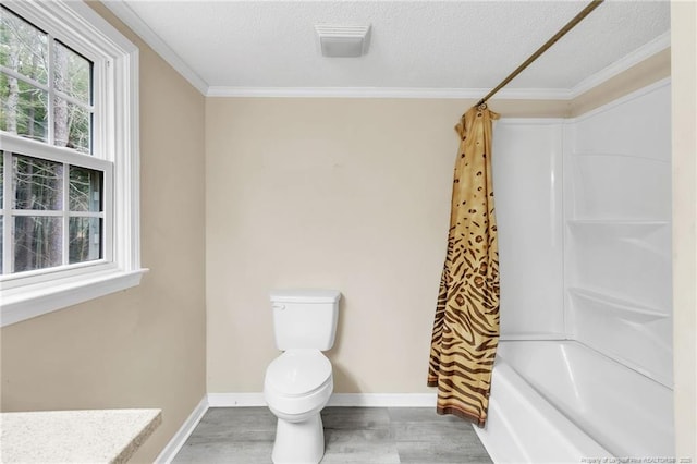 12621 Coble Dr, Laurinburg, NC 28352 - full bathroom featuring baseboards, toilet, wood finished floors, and a textured ceiling
