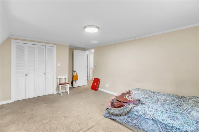 12621 Coble Dr, Laurinburg, NC 28352 - bedroom with a closet, crown molding, baseboards, and carpet floors