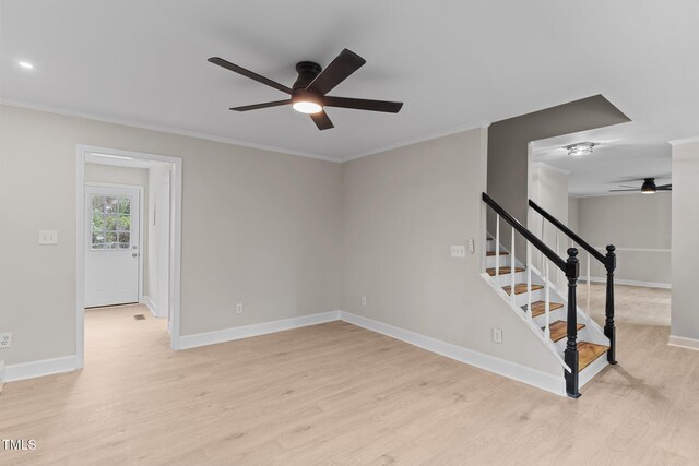 unfurnished room with baseboards, light wood-type flooring, crown molding, and ceiling fan