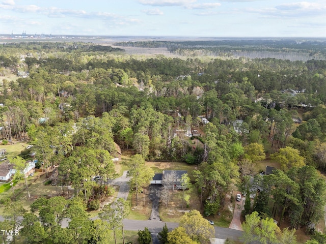 drone / aerial view featuring a view of trees