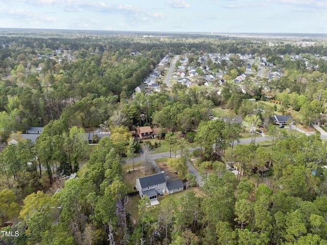 drone / aerial view featuring a view of trees