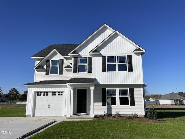91 Lotus Ave, Smithfield, NC 27577 - modern farmhouse with an attached garage, concrete driveway, roof with shingles, and a front yard