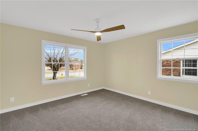 1772 Inverness Dr, Fayetteville, NC 28304 - empty room featuring visible vents, baseboards, dark carpet, and ceiling fan
