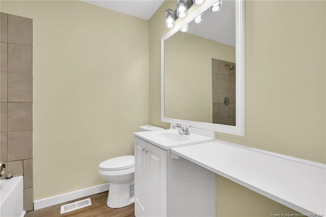 1772 Inverness Dr, Fayetteville, NC 28304 - bathroom featuring visible vents, toilet, a shower, baseboards, and vanity