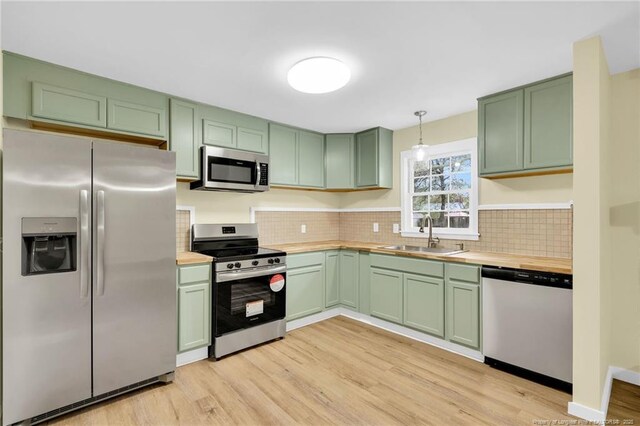 1772 Inverness Dr, Fayetteville, NC 28304 - kitchen with green cabinetry, wood counters, appliances with stainless steel finishes, and a sink