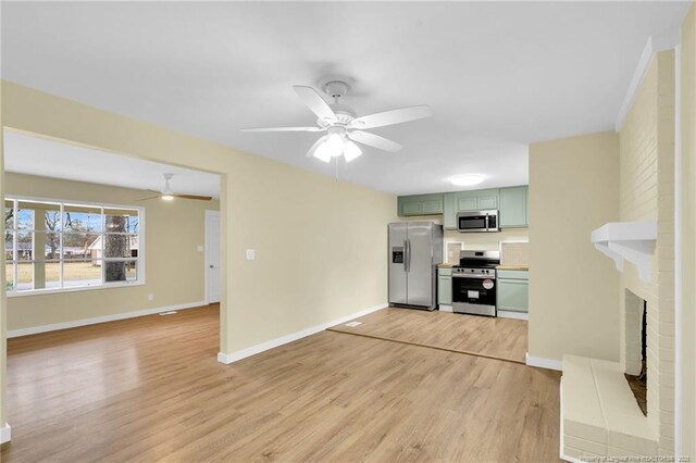 1772 Inverness Dr, Fayetteville, NC 28304 - unfurnished living room with baseboards, light wood-style floors, a brick fireplace, and ceiling fan