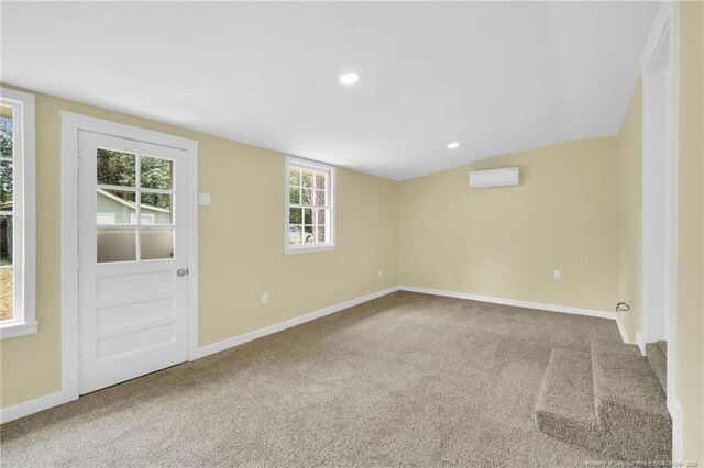 1772 Inverness Dr, Fayetteville, NC 28304 - spare room with a wall mounted AC, baseboards, and carpet floors