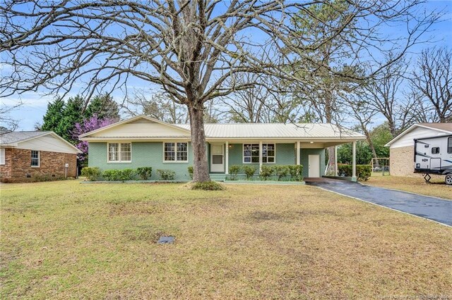 1772 Inverness Dr, Fayetteville, NC 28304 - ranch-style house featuring aphalt driveway, an attached carport, and a front lawn