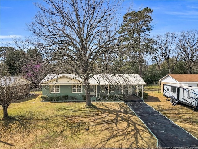 1772 Inverness Dr, Fayetteville, NC 28304 - view of front facade with aphalt driveway, a front lawn, and a carport