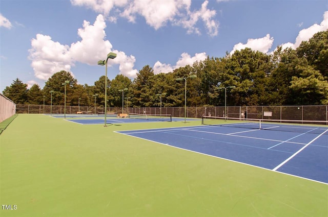 view of sport court featuring community basketball court and fence