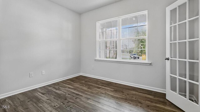 1010 Ocean Ct, Carthage, NC 28327 - empty room with baseboards and dark wood-type flooring