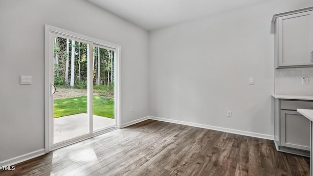 1010 Ocean Ct, Carthage, NC 28327 - unfurnished dining area with dark wood-style floors and baseboards