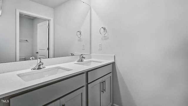1010 Ocean Ct, Carthage, NC 28327 - bathroom featuring double vanity and toilet