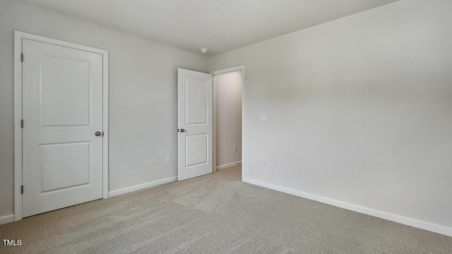 1010 Ocean Ct, Carthage, NC 28327 - unfurnished bedroom featuring light carpet and baseboards