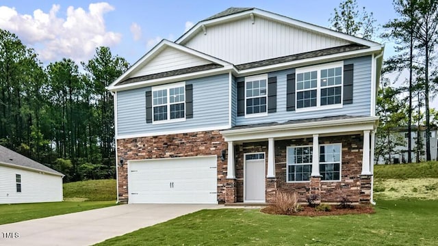 1014 Ocean Ct, Carthage, NC 28327 - craftsman-style house featuring a front lawn, driveway, an attached garage, and brick siding