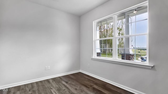 1014 Ocean Ct, Carthage, NC 28327 - spare room featuring baseboards and dark wood-type flooring