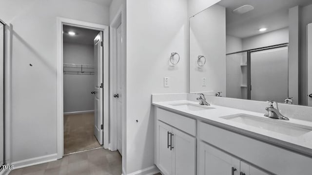 1014 Ocean Ct, Carthage, NC 28327 - bathroom with a shower stall, double vanity, and a walk in closet