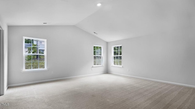 1014 Ocean Ct, Carthage, NC 28327 - carpeted spare room featuring lofted ceiling and plenty of natural light