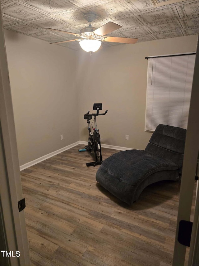 225 Sebastian Way, Rocky Mount, NC 27804 - workout area featuring baseboards, an ornate ceiling, ceiling fan, and dark wood-type flooring